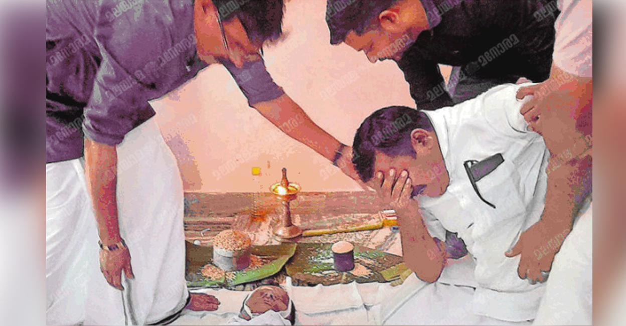Alimon sobbing near the body of Rajan. Photo: Manorama
