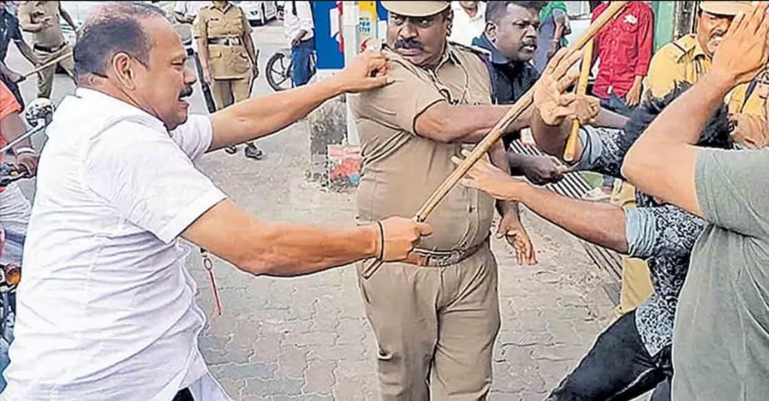 CM's gunman Anilkumar beats protesters who waved black flags. Photo: Manorama