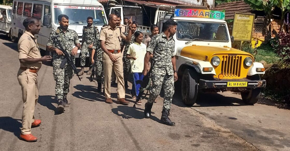 Maoist activist Unnimaya (t-shirt) is taken by the Crime Branch and Thunderbolts for evidence collection in Kozhikode district on Thursday. Photo: Special arrangement
