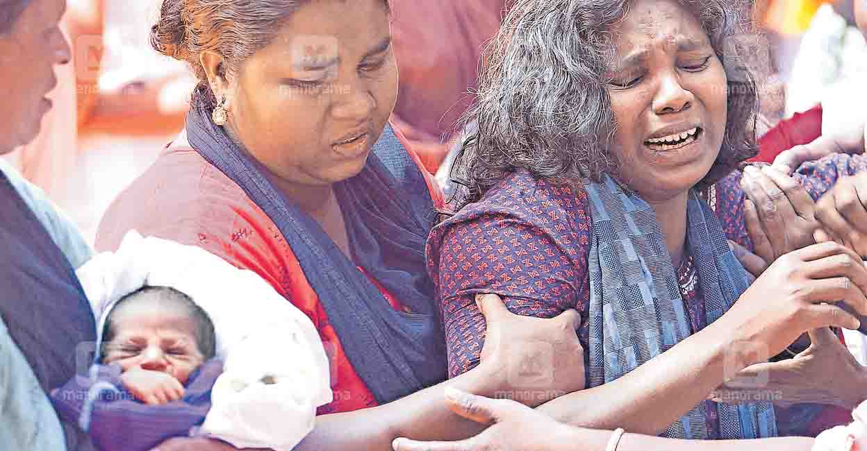 Viswanathan's wife breaks down when his body was brought to Kalpetta. Photo: MAnorama
