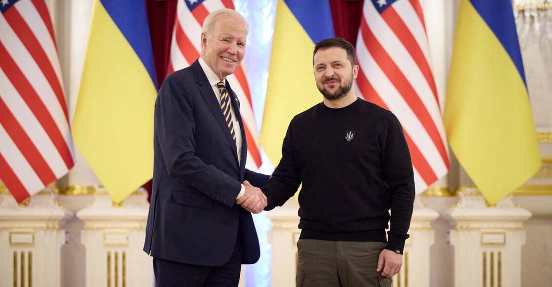 US President Joe Biden (left) shakes hands with Ukrainian President Volodymyr Zelensky during his visit in Kyiv on Monday. Photo: Reuters