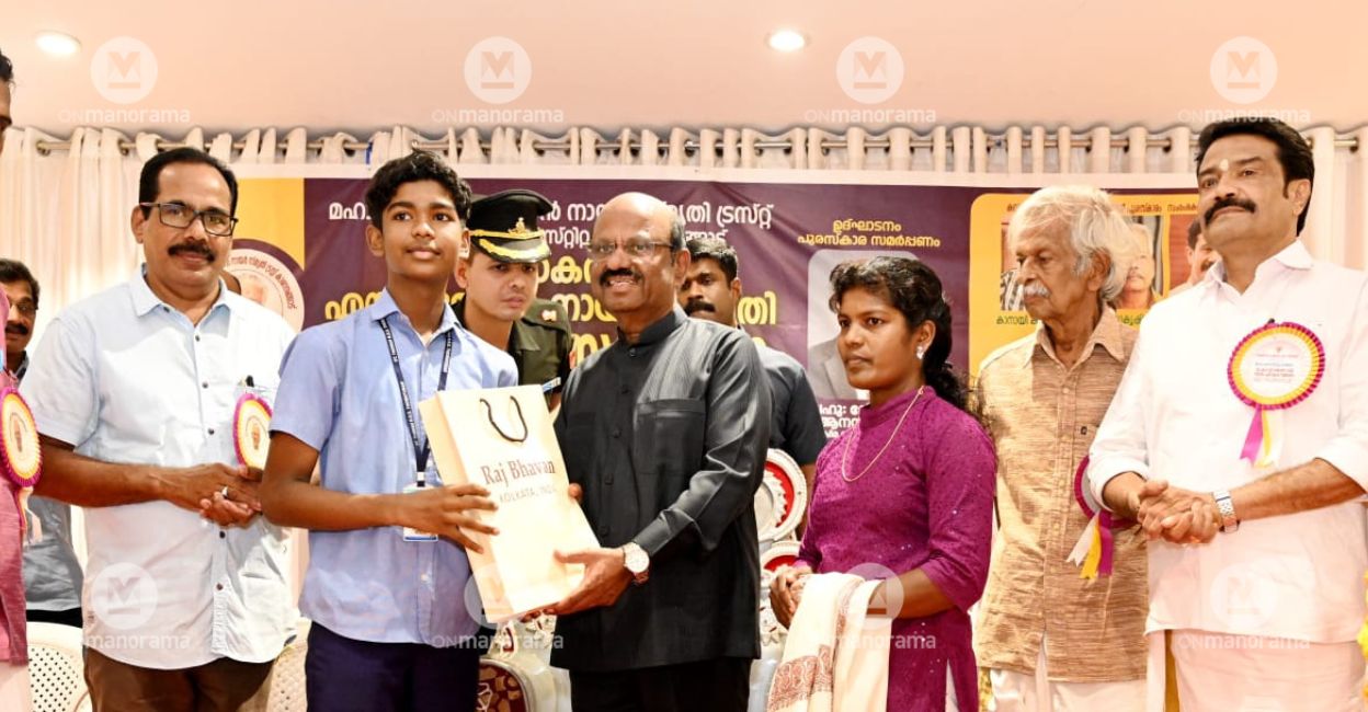 West Bengal Governor C V Ananda Bose handing over a gift from Raj Bhavan, Kolkata, to Sachu Satheesh at a function at Kanhangad in Kasaragod district on Monday. Sachu's mother Bindu is on the right. Photo: Special Arrangement