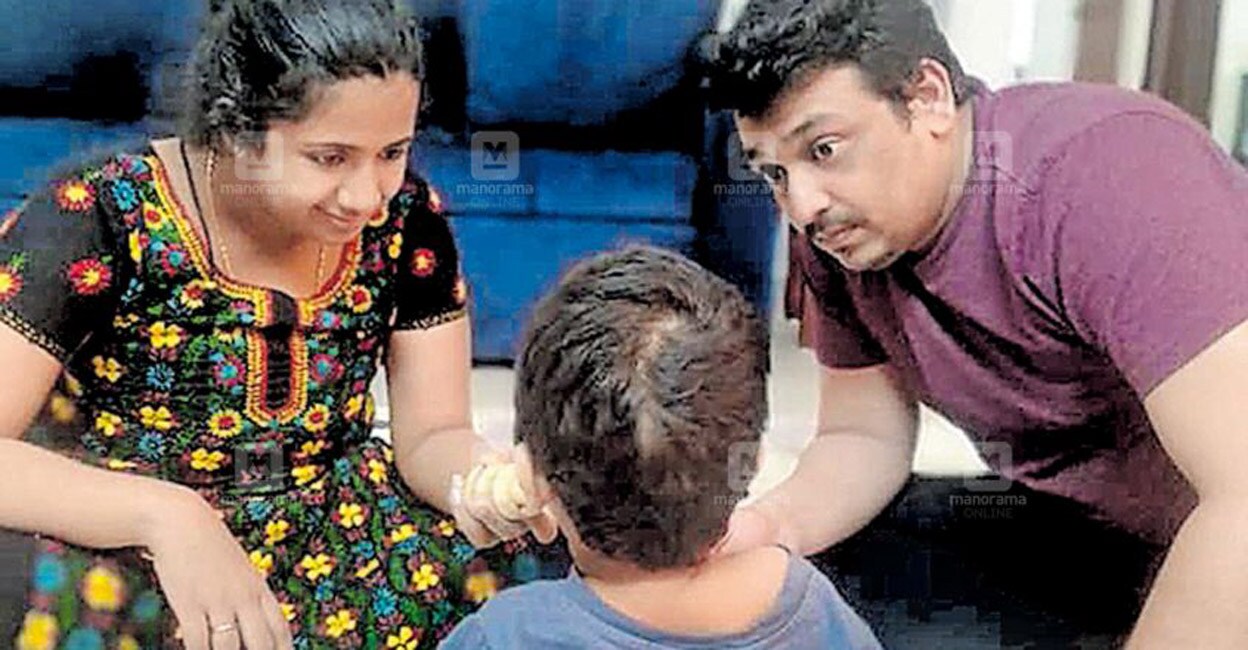 Nirvaan with his parents, Sarang Menon and Adithi Nair. Photo: Manorama Online