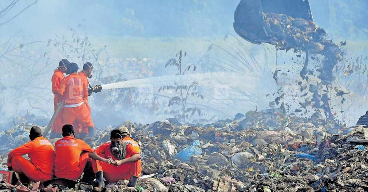 Fire and Rescue officers trying to douse the fire at Brahmapuram waste treatment plant in Kochi. Photo: Josekutty Panackal