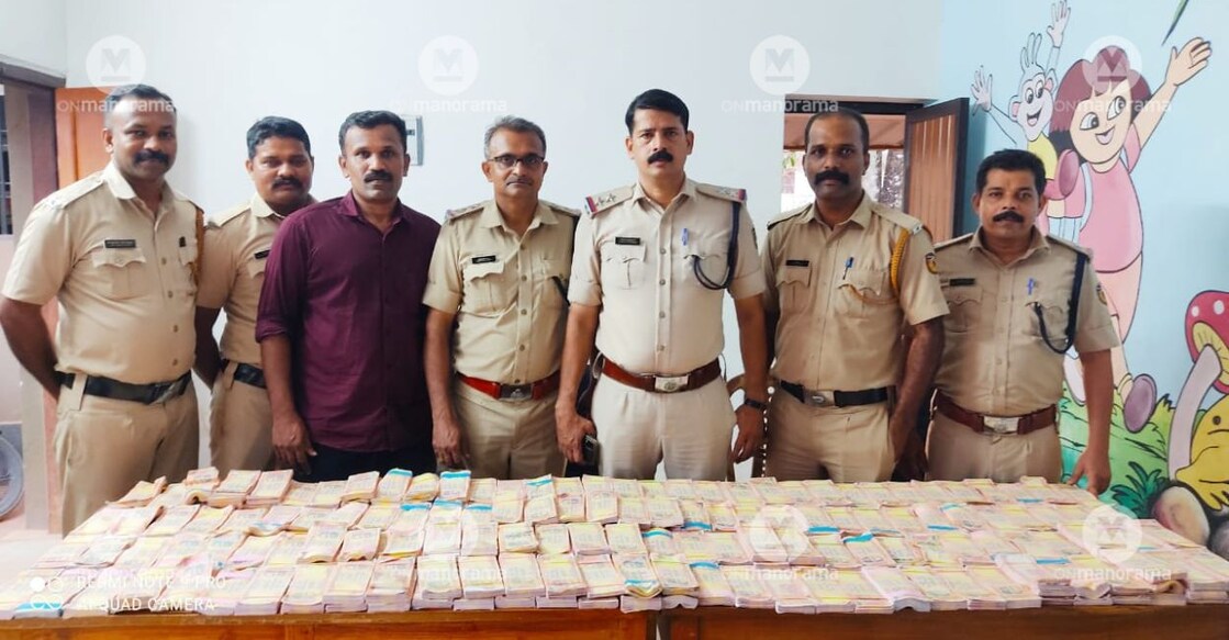 The police team with the fake notes that were seized from a house in Kasaragod. Photo: Special Arrangement
