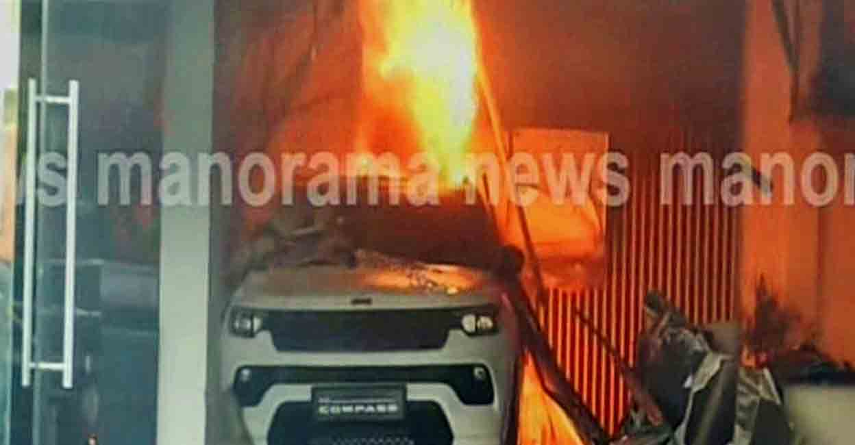 Fire at car showroom in Thrissur. Photo: Screengrab/Manorama news