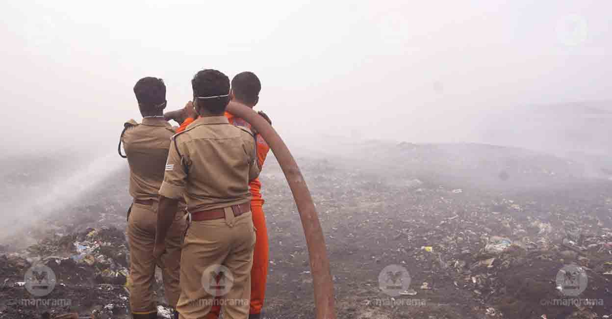 brahmapuram-fire-smoke Firefighters try to douse the fire at Brahmapuram waste plant. Photo: I & PRD