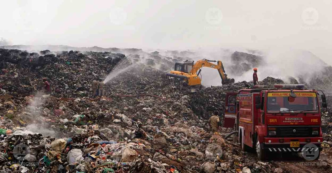 brahmapuram-fire-smoke2 Firefighters attempt to douse fire at Brahmapuram waste plant. Photo: I &PRD