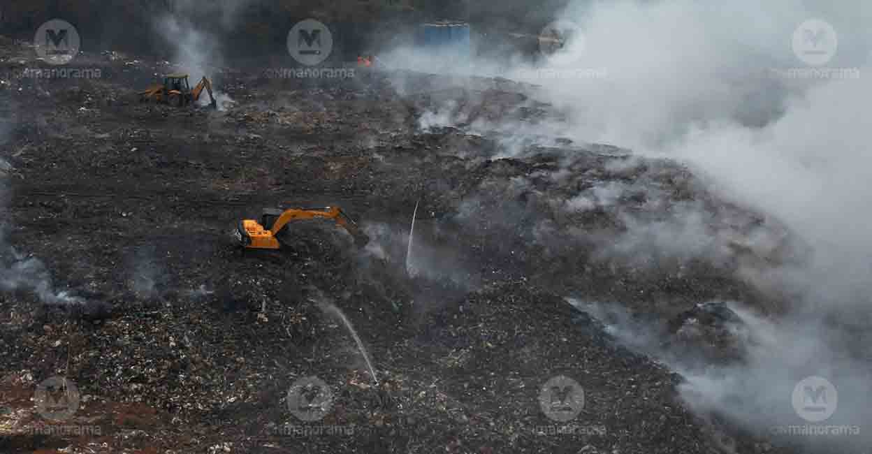 Brahmapuram fire Excavators used to douse the fire at Brahmapuram solid waste plant. Photo: E V Sreekumar/Manorama