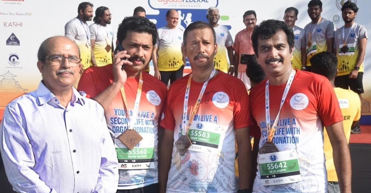 dinoy-add-3 (From left) Dr Jose Chack Periyappuram, physiotherapist Felvin and Dr Jo Joseph with Dinoy after the Spice Coast Marathon in Kochi. Photo: Special Arrangement