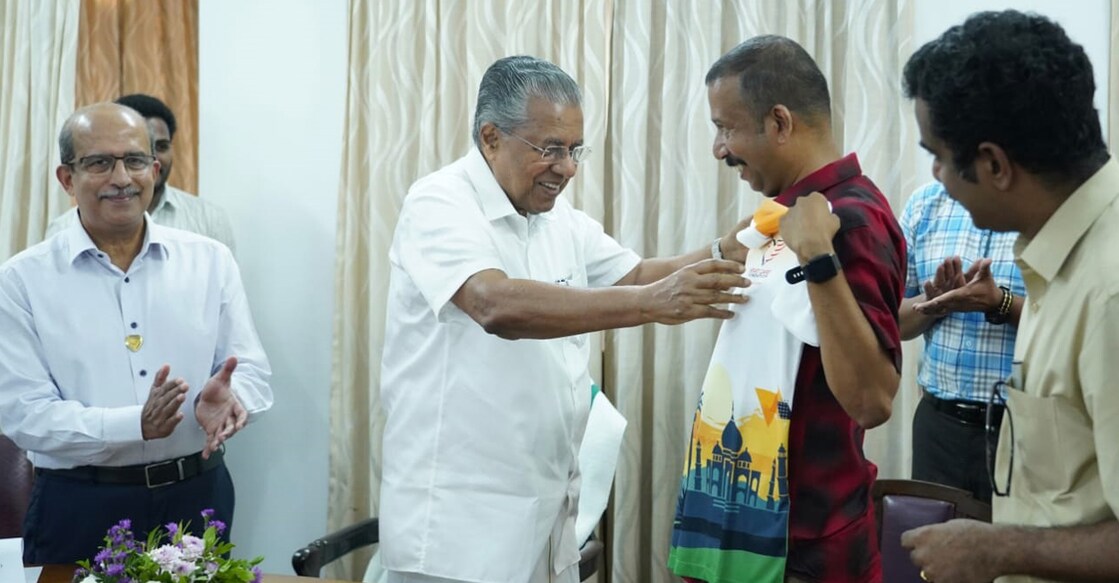 dinoy-main Chief Minister Pinarayi Vijayan presents a jersey to Dinoy Thomas in Kochi. Photo: I&PRD