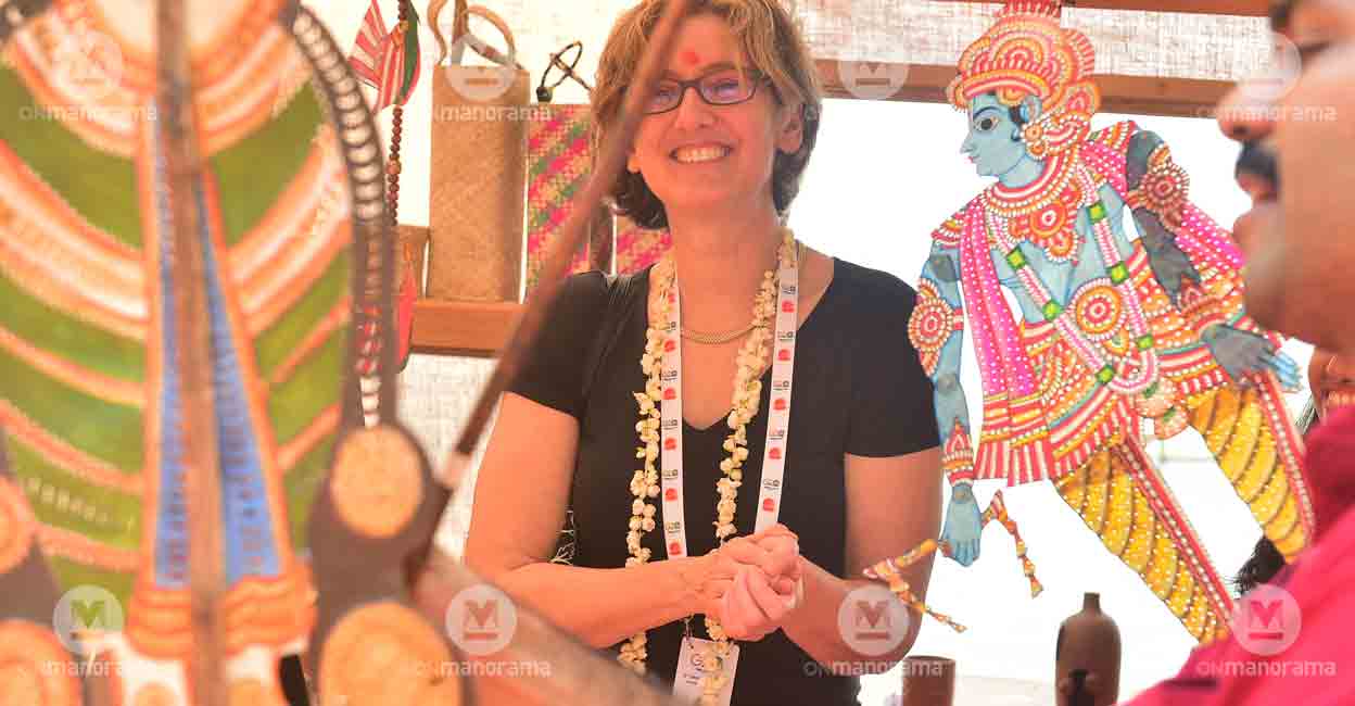 A foreign delegate enjoys Pavakoothu at the G20 Sherpas meet in Kumarakom. Photo: Manorama