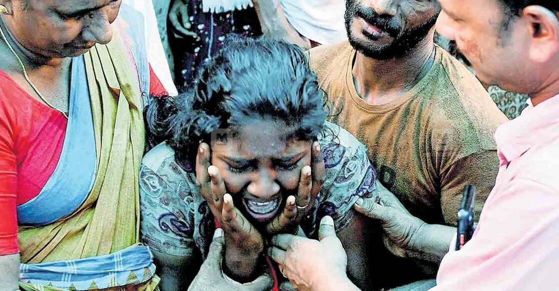 Rahna, daughter of Raghu, cries seeing her father after he was killed by an elephant. Photo: Manorama