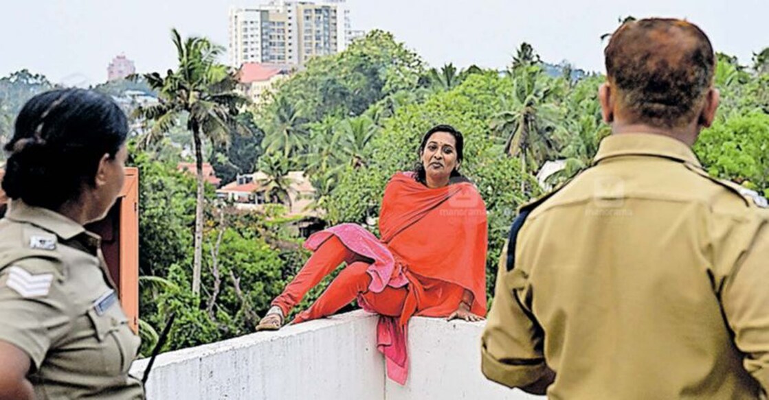 Police and Fire Force personnel got Sreeranjini down half an hour later after assuring her of appropriate action. Photo: Manorama Online