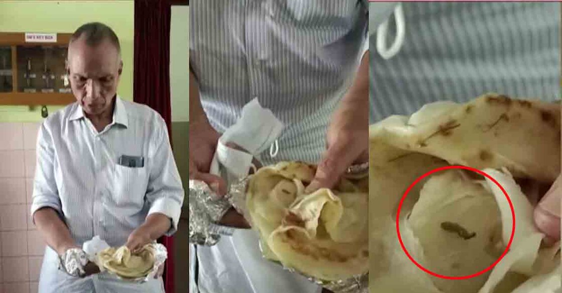 The passenger showing the worm he found in the porotta. Video grab