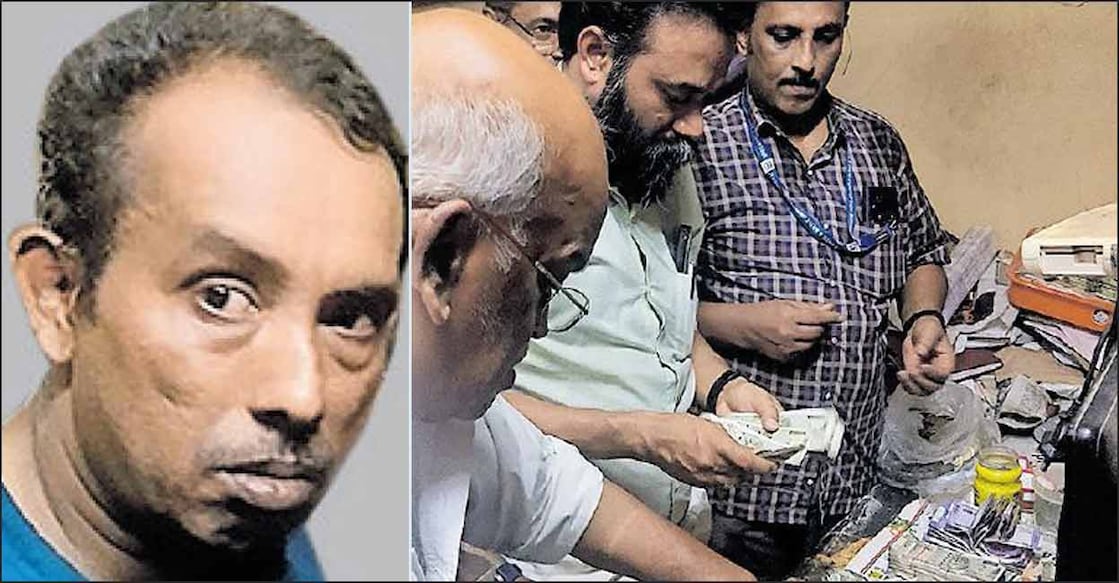 (1) സുരേഷ് കുമാർ (2) കൈക്കൂലിക്കേസിൽ അറസ്റ്റിലായ സുരേഷ്കുമാറിന്റെ താമസ സ്ഥലത്തു നിന്നു കണ്ടെടുത്ത നോട്ടുകൾ എണ്ണിത്തിട്ടപ്പെടുത്തുന്നു. 