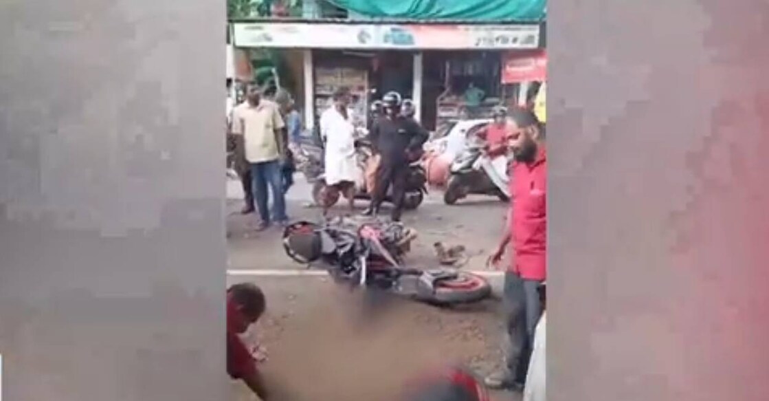 The three men were travelling on the bike without helmet. Photo: Screengrab./Manorama News
