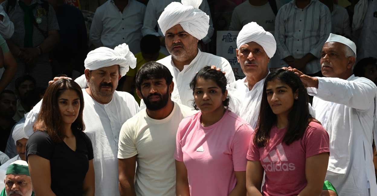 Farmer leader Naresh Tikait and other farmer leaders meet Wrestlers Bajrang Punia, Vinesh Phogat, Sakshi Malik during a protest at Jantar Mantar, in New Delhi, on Thursday, April 27, 2023. Photo: Wasim Sarvar/IANS