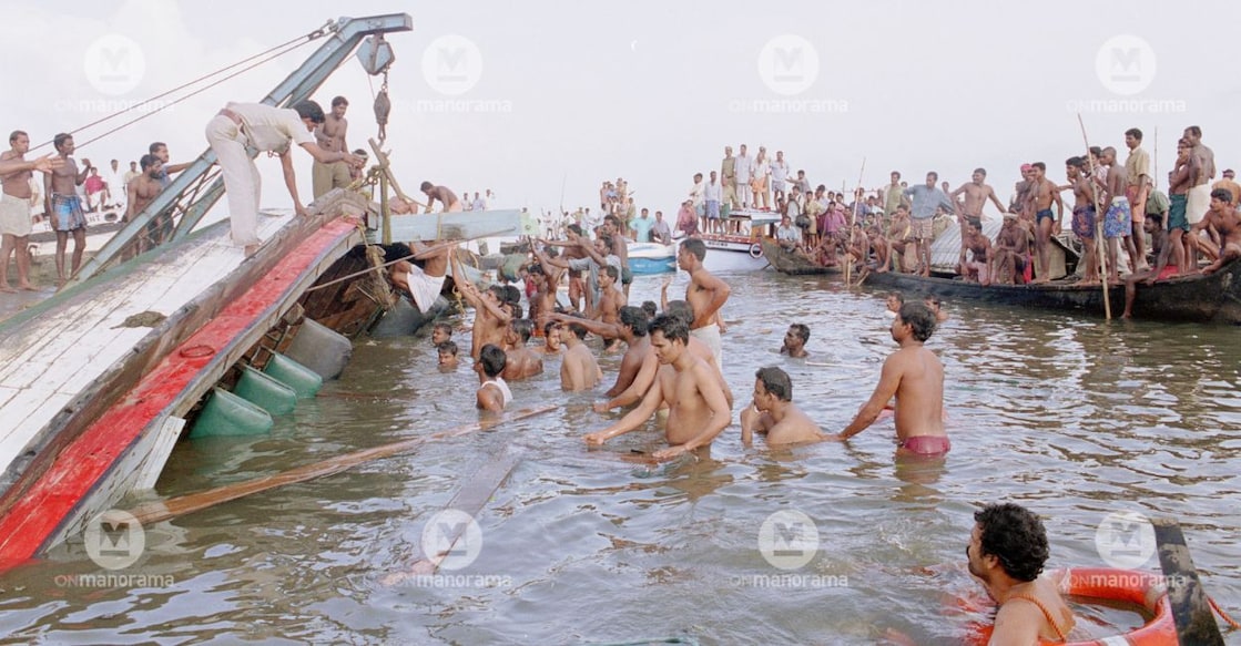 Locals and police personnel engaged in a rescue operation at Kumarakom in 2002. File Pic: Manorama