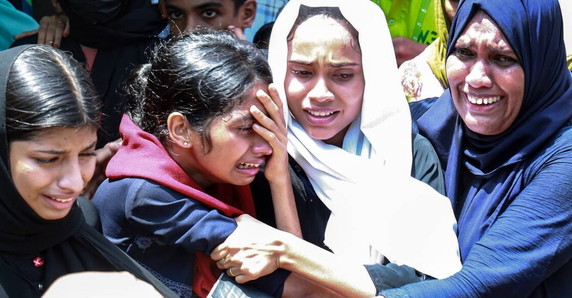 Relatives react after a boat capsized near Thoovaltheeram beach killing at least 22 people, in Malappuram. Photo: PTI