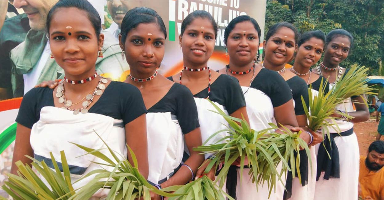 Youngsters from 'Thudithalam' group perform while collecting tender paddy leaves for Kambalanatti, a planting festival. Photo: Special arrangement