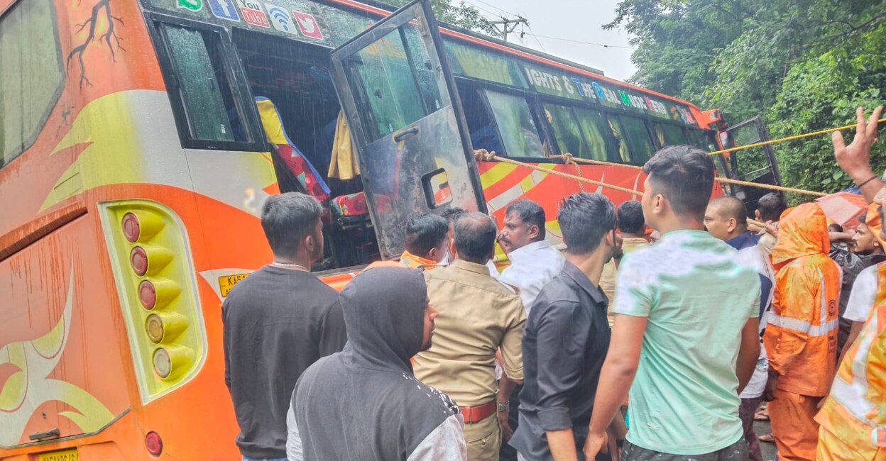Personnel of Fire & Rescue and police pull the tourist bus onto the road with the help of locals near Adimaly on Thursday. Photo: Special arrangement
