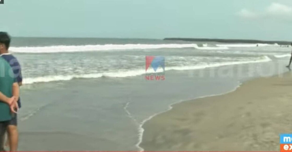 kozhikode beach The children got trapped in the high tides while chasing their football that fell into the sea. Photo: Screengrab/ Manorama News