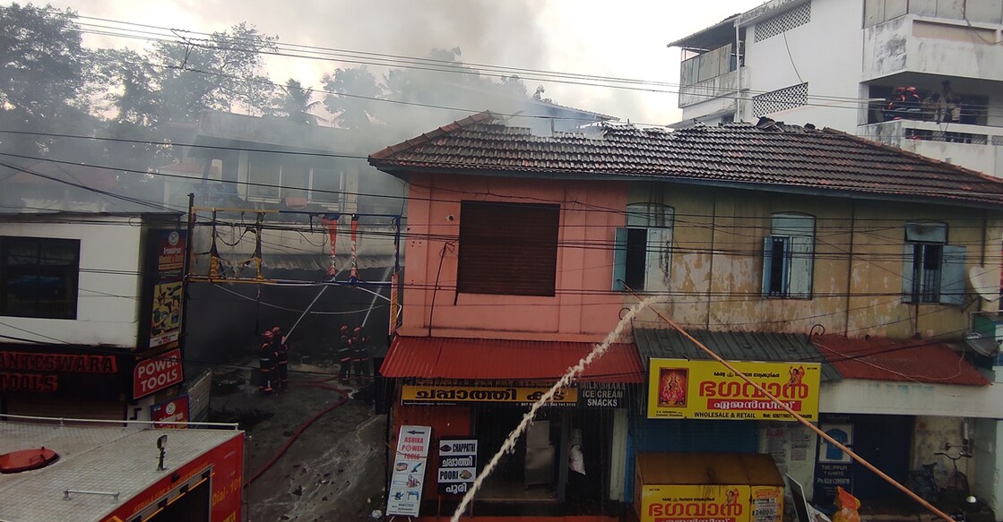 A Fire and Rescue unit attempting to put out the fire at a shop selling chemicals at Aryasala in Thiruvananthapuram on Monday. Photo: Manorama