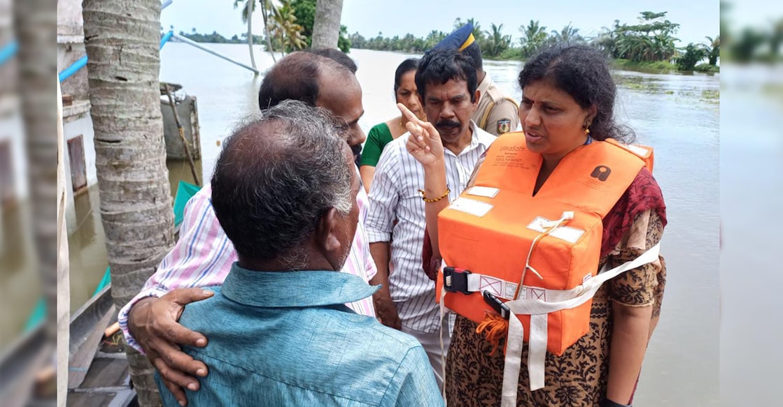 Alappuzha District Collector Haritha V Kumar consoles Gopikuttan at a relief camp in Kuttanad. Photo: Special arrangement