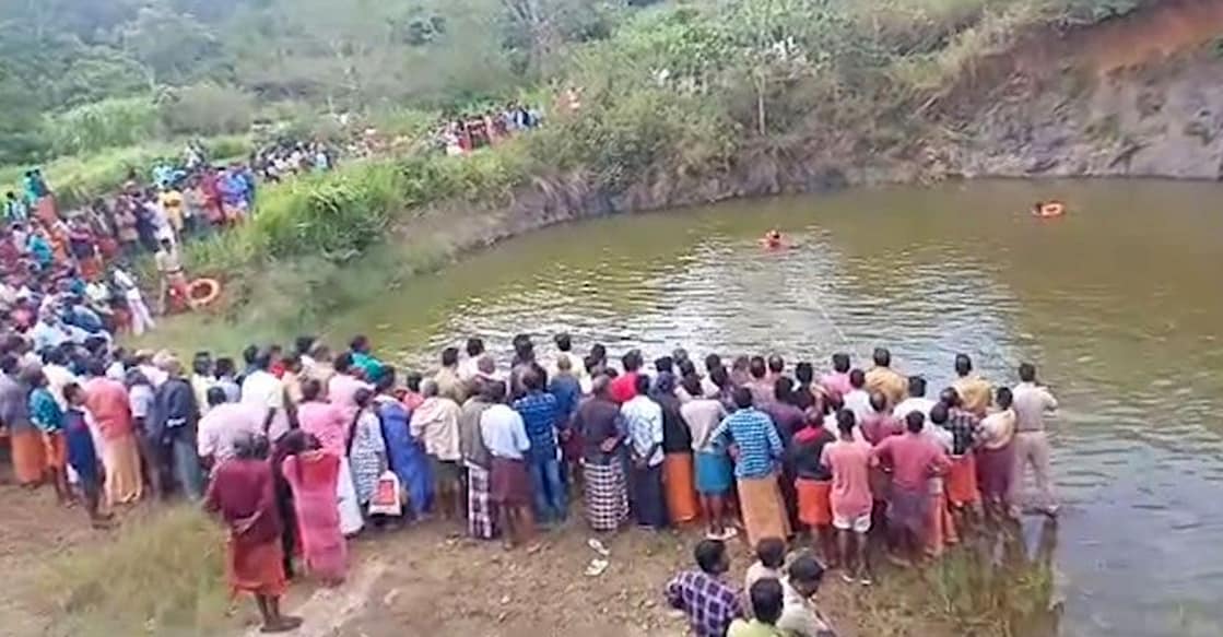 malappuram-quarry-drowning Locals watch as rescue personnel look for two youths who drowned in a quarry at Vandanmedu in Idukki. Photo: Screengrab/Manorama News