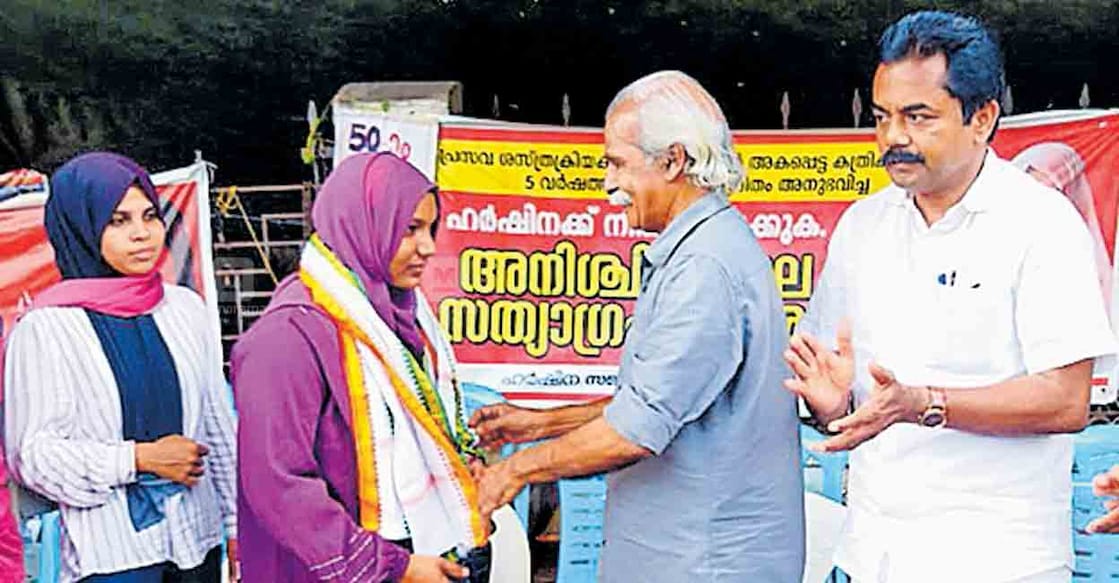 kozhikode-harshina-strike Kalpetta Narayanan honours Harshina after she completed 50 days of protest in front of the Kozhikode medical college. Photo: Manorama