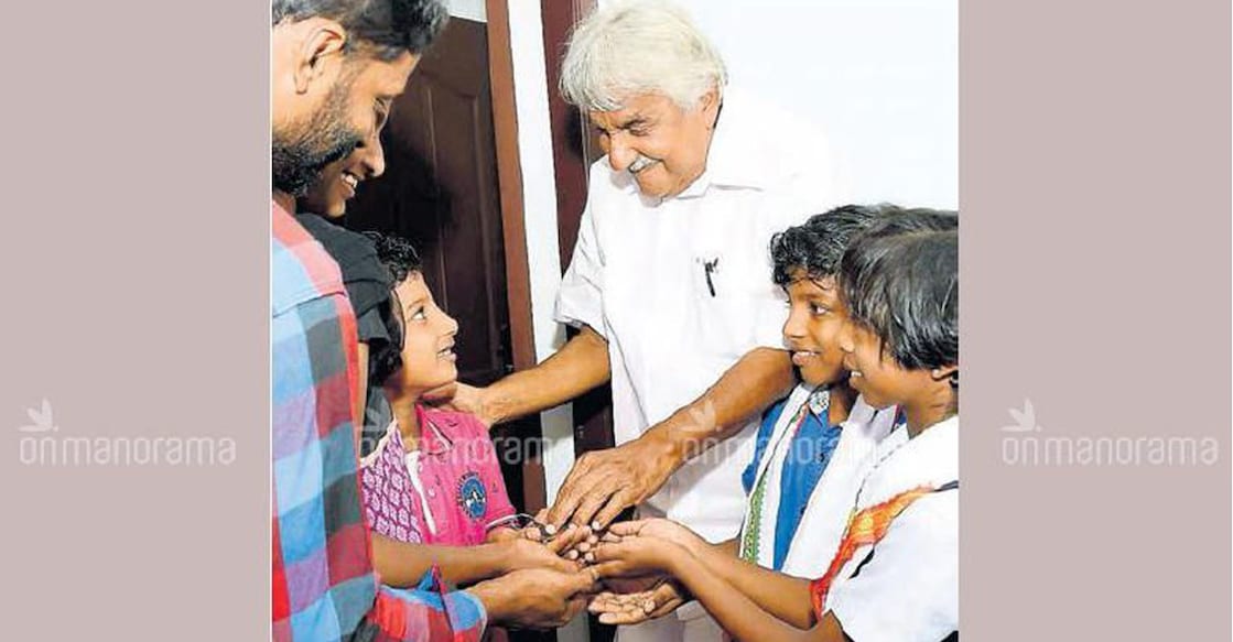 Chandy handing over the key to the house to Krishna. Photo: Manorama