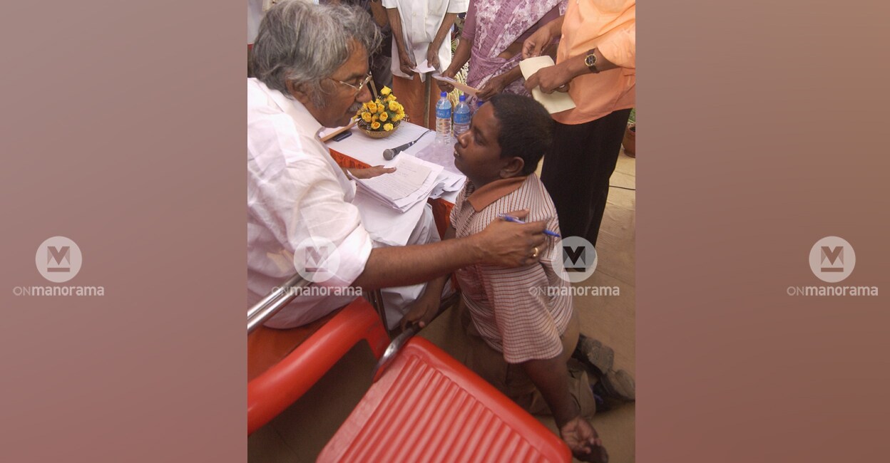 oommen-chandy-handicapped-lottery-agent-kannur In this photograph from March 7, 2005, then Kerala Chief Minister Oommen Chandy listens to the grievances of a disabled lottery seller in Kannur. File photo: Manorama