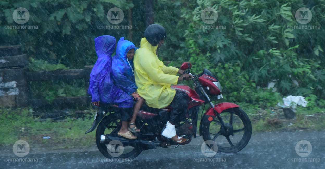 Children ride pillion on a bike in Kozhikode on Tuesday. Photo: Manorama