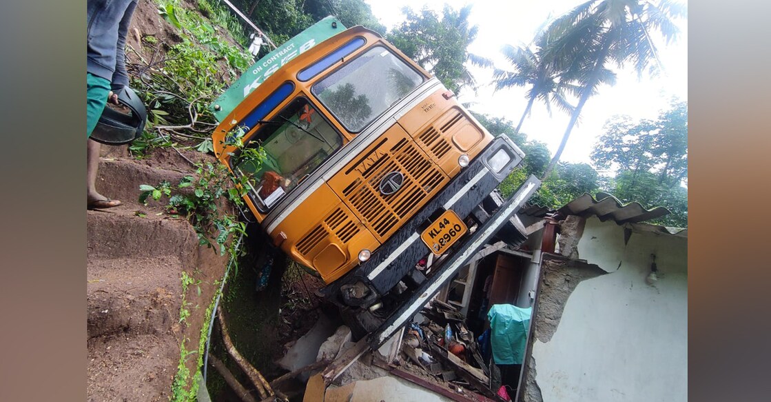 The truck fell over the house of Cheruvil Viswambaran at Panamkutty near Adimaly on July 1. Photo: Special arrangement