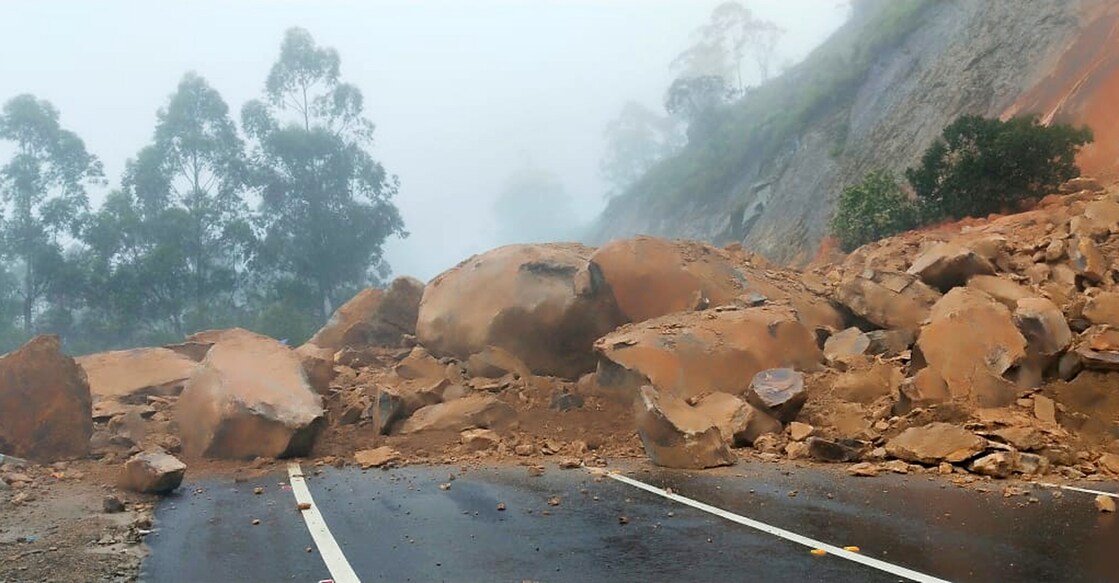 Huge boulders sit on the Gap Road of the Kochi-Danushkodi National Highway after a landslide Friday morning. Photo: Special arrangement 