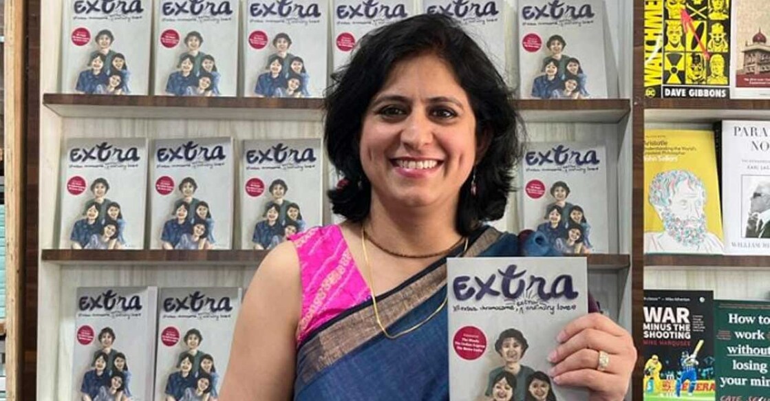 Shivani Dhillon with the book  'Extra'. Written by children’s author Archana Mohan and illustrated by Prarthana Merchant the book has Shivani's daughter as a character in it. Photo: Facebook/ DownSyndromeSupportGroupIndia