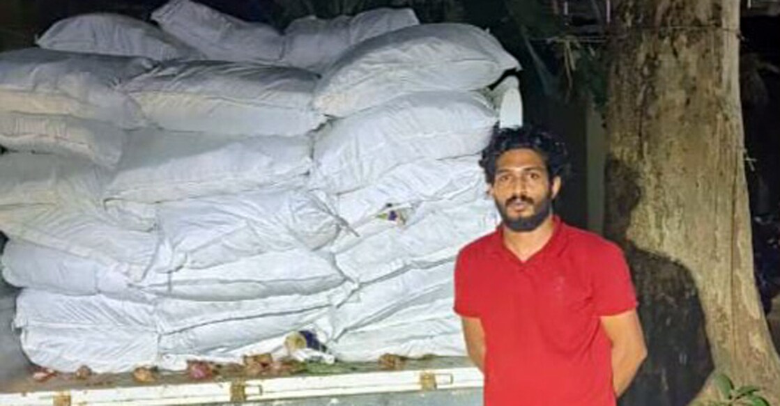 The accused Shouhan Surbaz posing in front of the truck, from which the banned substances were seized. Photo: Special arrangement