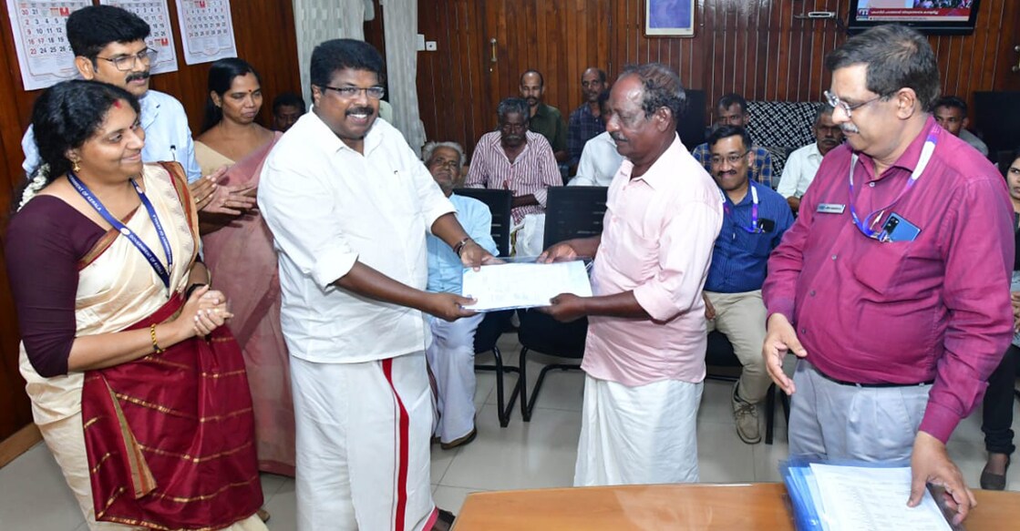 sbi-returns-documents-fishermen P P Chitharanjan MLA hands over the documents to a fisherman in the chamber of district collector Haritha V Kumar (left). Photo: Special arrangement