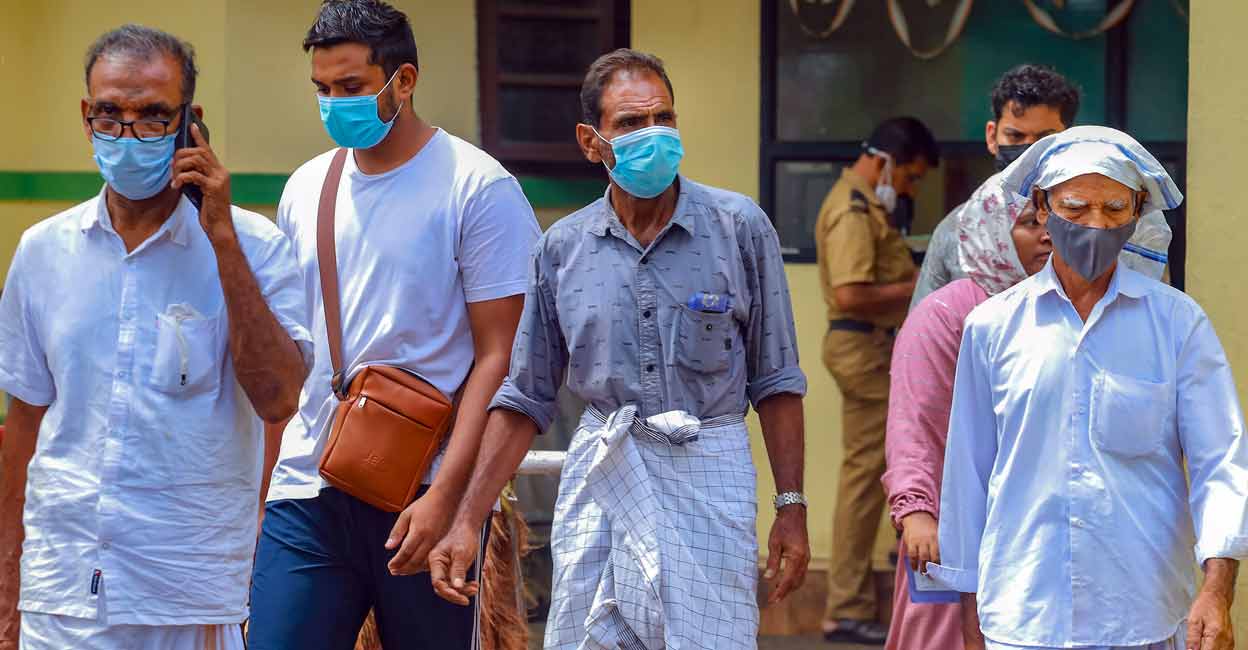 PTI09_12_2023_000193A People wear masks at a medical college after the Nipah virus alert, in Kozhikode, Tuesday, Sept. 12, 2023. Photo: PTI