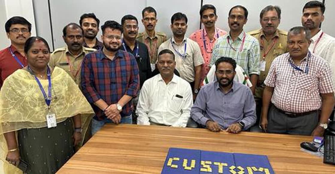 customs-seizure-karipur Customs officials posed with the gold tablets seized from a flight. Photo: Special arrangement