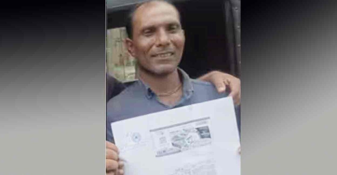 Ashok with a copy of his first prize winning lottery. Photo: Special Arrangement