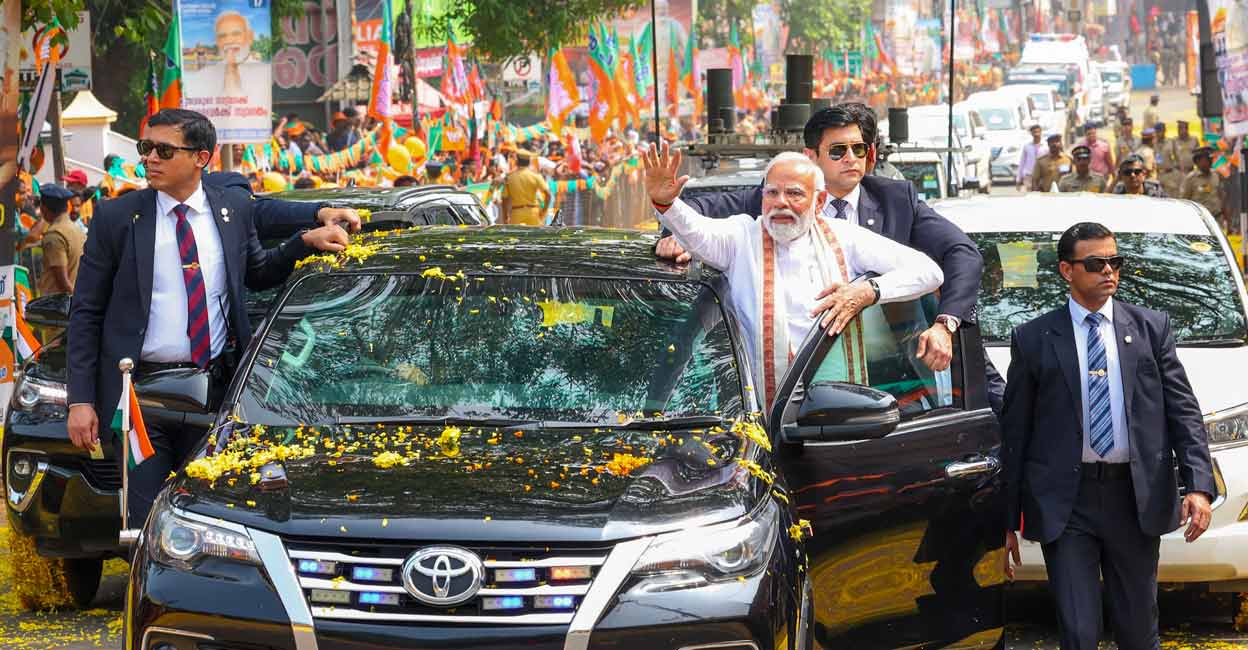 PM Modi in Kerala Prime Minister Narendra Modi waves at people gathered for his welcome upon his arrival at Thriprayar, in Thrissur district, Wednesday. Photo: PTI