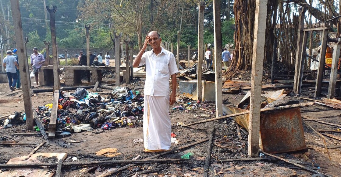 Mamu, a street vendor, who relied on the fishermen's sheds to store his goods, looks dejected after the fire at Chaliyam Fish Landing Centre. Photo: Special arrangement