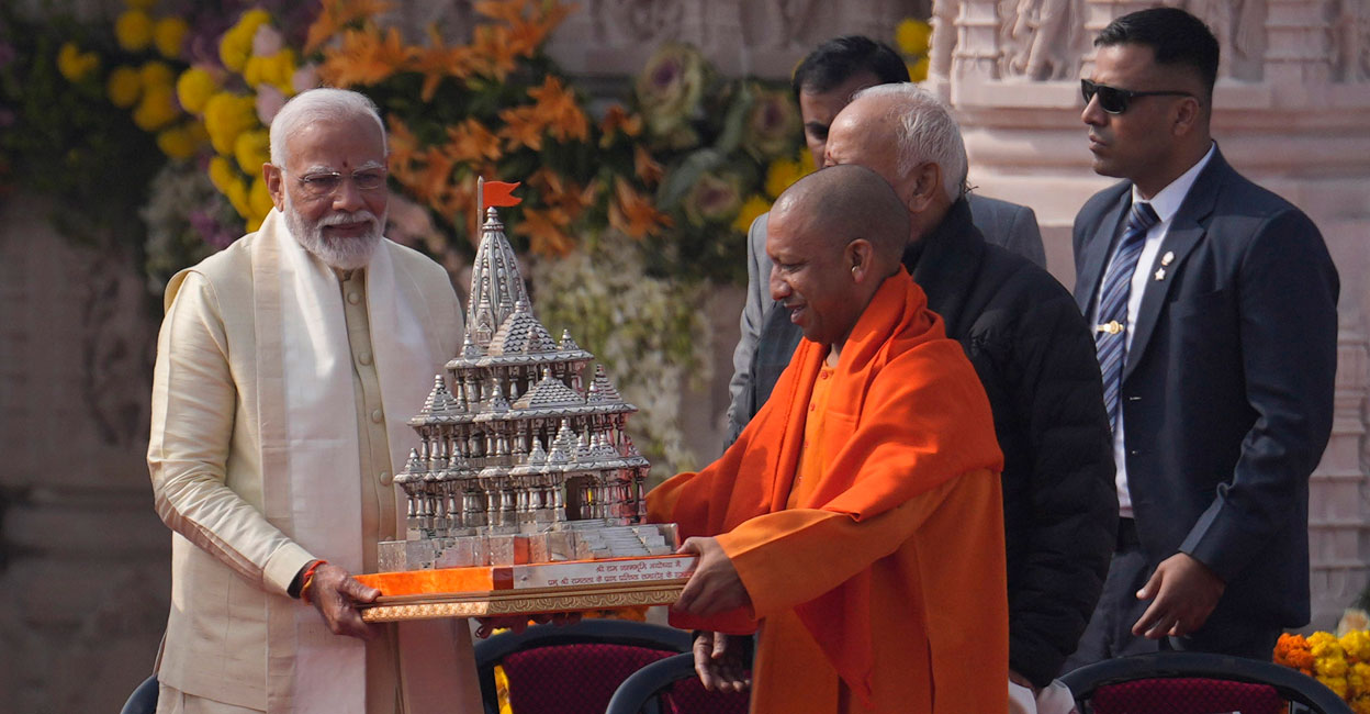 Prime Minister Narendra Modi receives a souvenir from Uttar Pradesh Chief Minister Yogi Adityanath after the opening of the Ayodhya Ram Temple. Photo: PTI