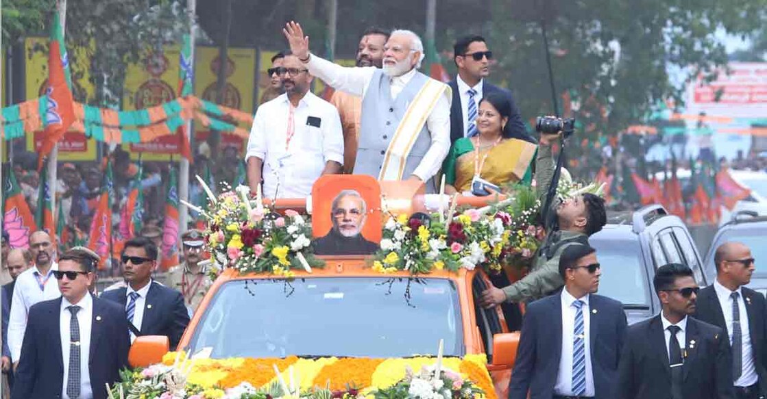 Prime Minister Narendra Modi greets crowd during roadshow at Thrissur. Photo: Special arrangement