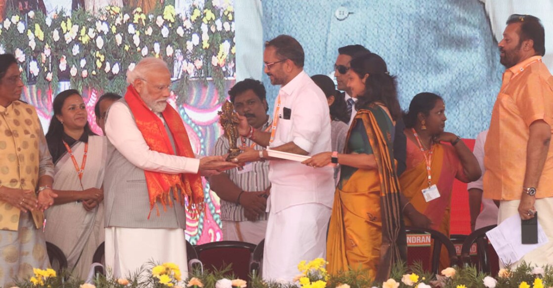 Prime Minister Narendra Modi is gifted a memento by BJP Keralam president K Surendran in Thrissur on Wednesday. Photo: Special arrangement