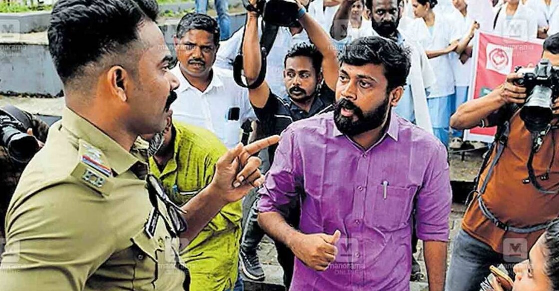 si-shameel-mla-vijin The open verbal tussle between the MLA and the Sub Inspector erupted during the protest of the Kerala Government Nurses Association (KGNA) at Kannur collectorate on Thursday. Photo: Manorama