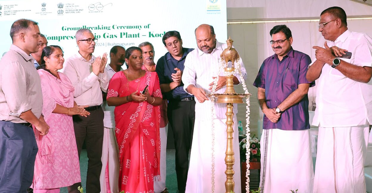 Kerala’s Industries Minister P Rajeeve lights the lamp at the groundbreaking ceremony of the compressed biogas (CBG) plant built at Brahmapuram by Bharat Petroleum Corporation Limited (BPCL) after Prime Minister Narendra Modi performed the ceremony online. Photo: Special arrangement