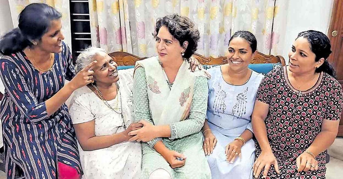 Priyanka Gandhi with Thressia and family in Wayanad's Bathery. Photo: Manorama